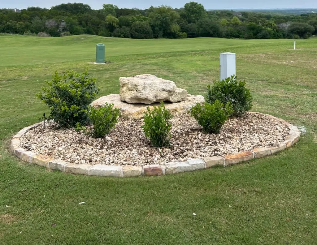Flower bed renovation with refreshed planting beds and layered landscaping in Burleson, Texas